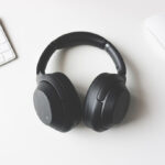 black headphones and white technology accessories