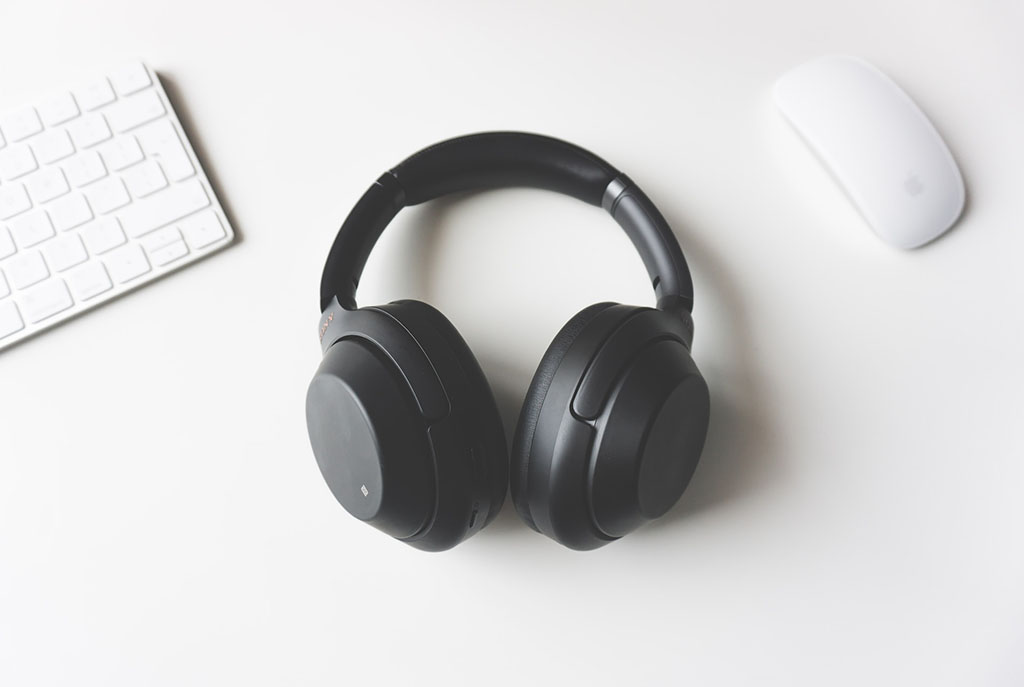 black headphones and white technology accessories